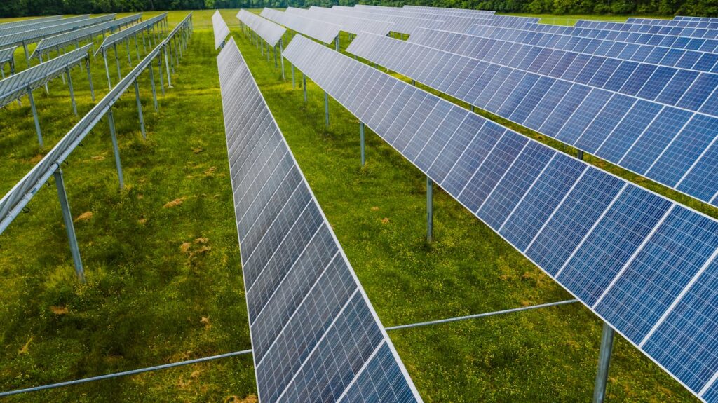 Aerial view of solar panels in a green field, Rossville, GA.